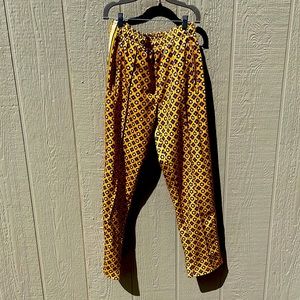Urban Outfitters gold patterned track pants. Size S